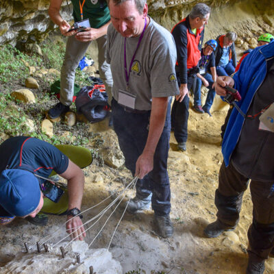 Using elastic cord to retain each set during placement and after crack opens and the rock fractures.